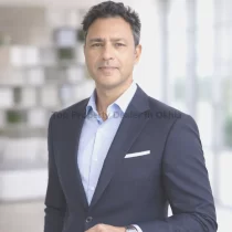 Professional industrial property dealer in Okhla Industrial Area, Delhi office portrait 2026