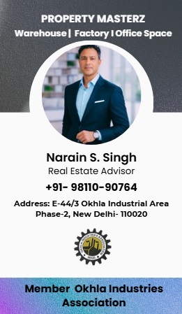 Trusted property dealer in Okhla Industrial Area showing a commercial building to a client.